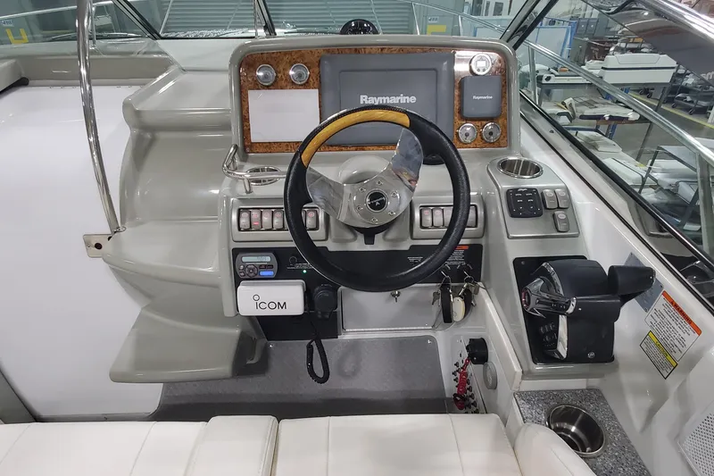 Slide: The Image of 2010 Formula 31 Performance Cruiser helm with Raymarine navigation system and ICOM radio. - 20