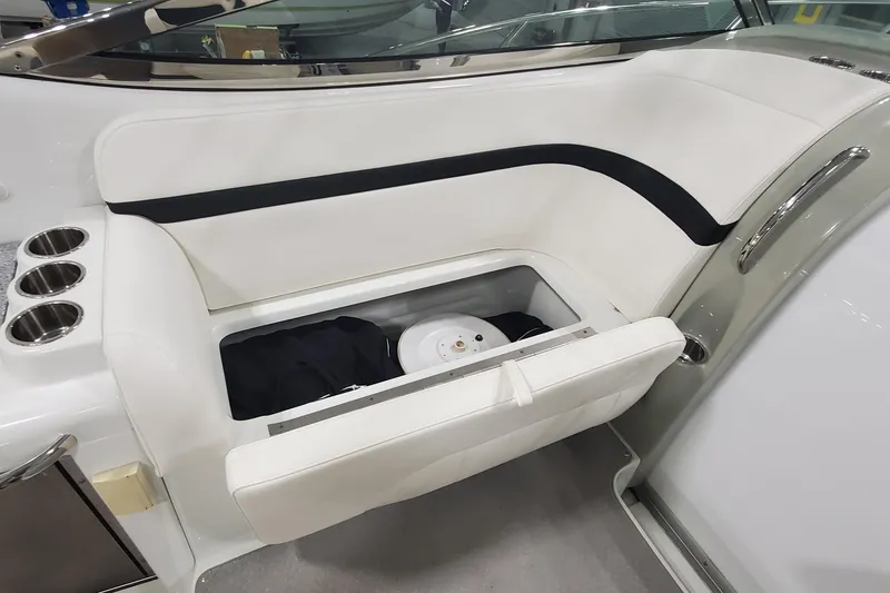 Slide: The Image of 2010 Formula 31 Performance Cruiser interior with open storage compartment and cup holders. - 22