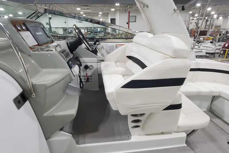 Slide: The Image of 2010 Formula 31 Performance Cruiser interior with white seating and modern dashboard. - 24