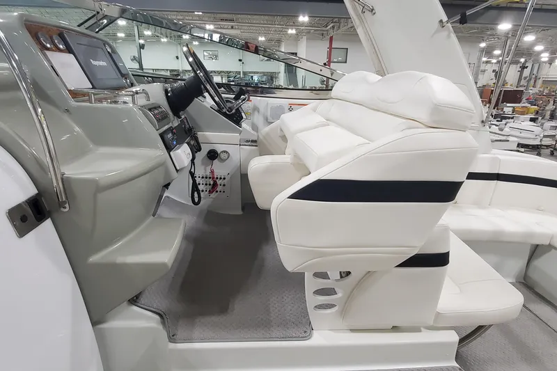 Slide: The Image of 2010 Formula 31 Performance Cruiser interior with white seating and modern dashboard. - 25