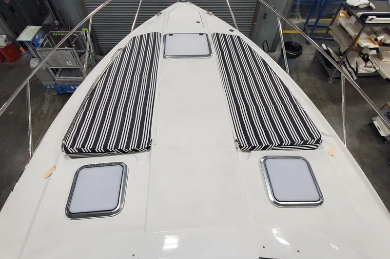 Slide: The Image of 2010 Formula 31 Performance Cruiser deck with striped cushions and hatches. - 29