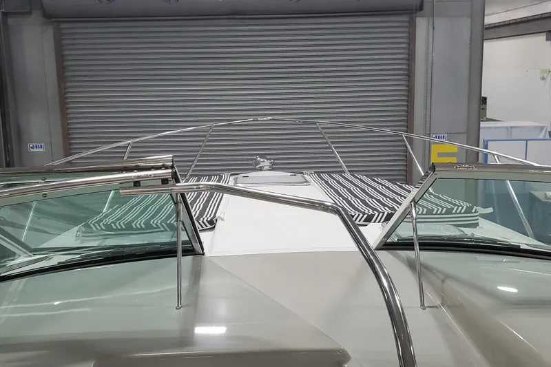 Slide: The Image of 2010 Formula 31 Performance Cruiser in a garage, featuring sleek design and striped cushions. - 31