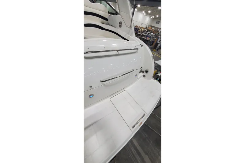 Slide: The Image of 2010 Formula 31 Performance Cruiser, white exterior, docked indoors. - 36