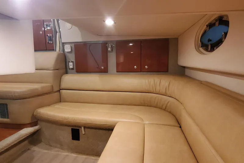 Slide: The Image of Interior of 2010 Formula 31 Performance Cruiser with beige seating and wooden cabinets. - 39
