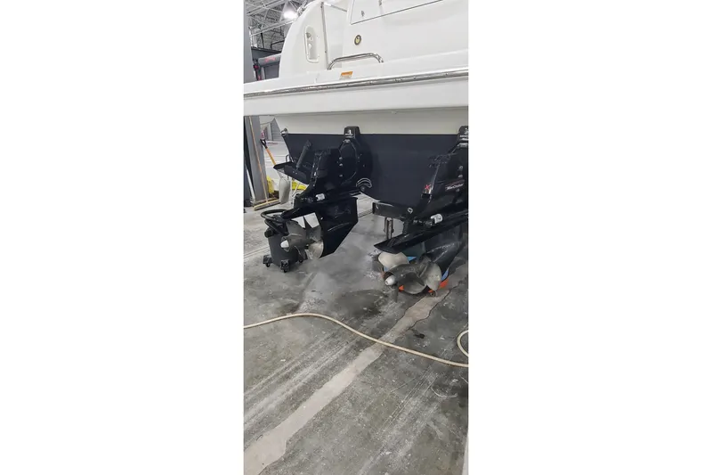 Slide: The Image of 2010 Formula 31 Performance Cruiser boat with dual propellers in a workshop setting. - 4