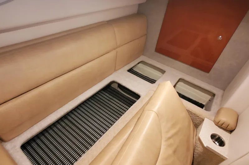 Slide: The Image of Interior of 2010 Formula 31 Performance Cruiser with beige seating and storage compartments. - 42