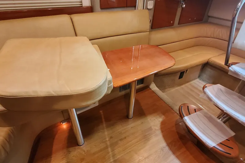 Slide: The Image of Interior of 2010 Formula 31 Performance Cruiser with beige seating and wooden table. - 43