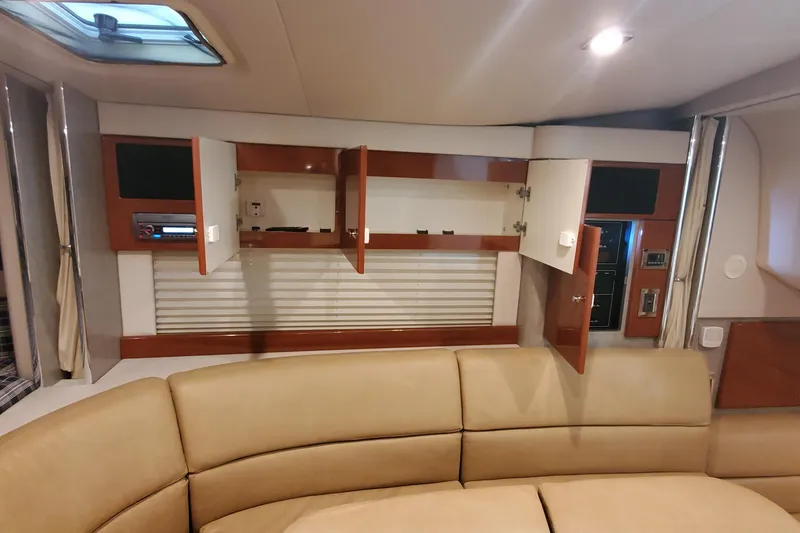 Slide: The Image of Interior of 2010 Formula 31 Performance Cruiser with open cabinets and beige seating. - 45