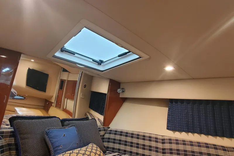 Slide: The Image of Interior of 2010 Formula 31 Performance Cruiser with skylight and plaid seating. - 50