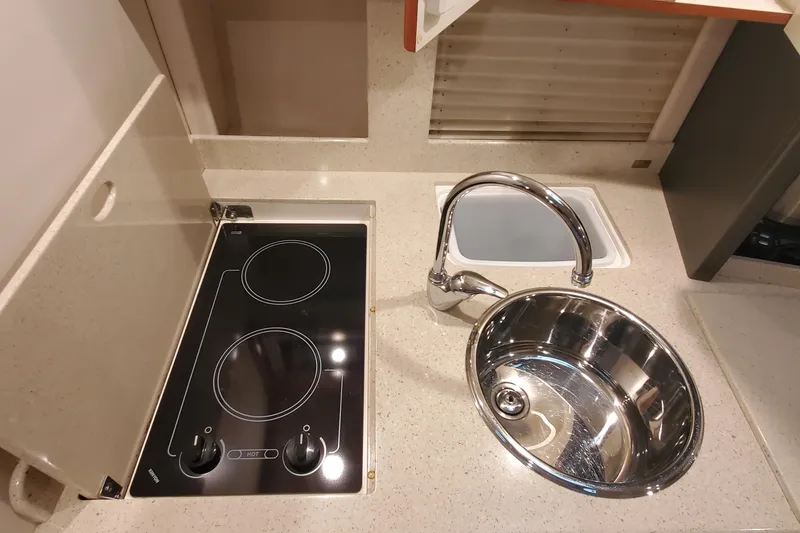 Slide: The Image of 2010 Formula 31 Performance Cruiser kitchen with stove and sink. - 56