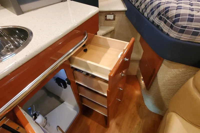 Slide: The Image of Interior of 2010 Formula 31 Performance Cruiser with open drawers and kitchenette. - 61
