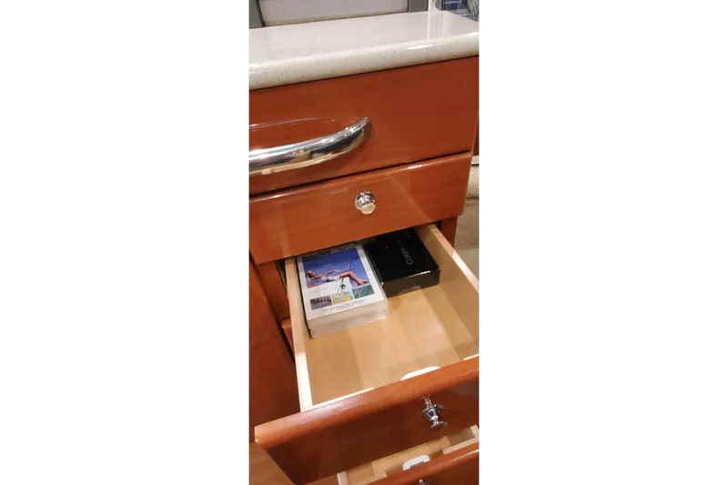 Slide: The Image of Open drawer in 2010 Formula 31 Performance Cruiser with brochures inside. - 63