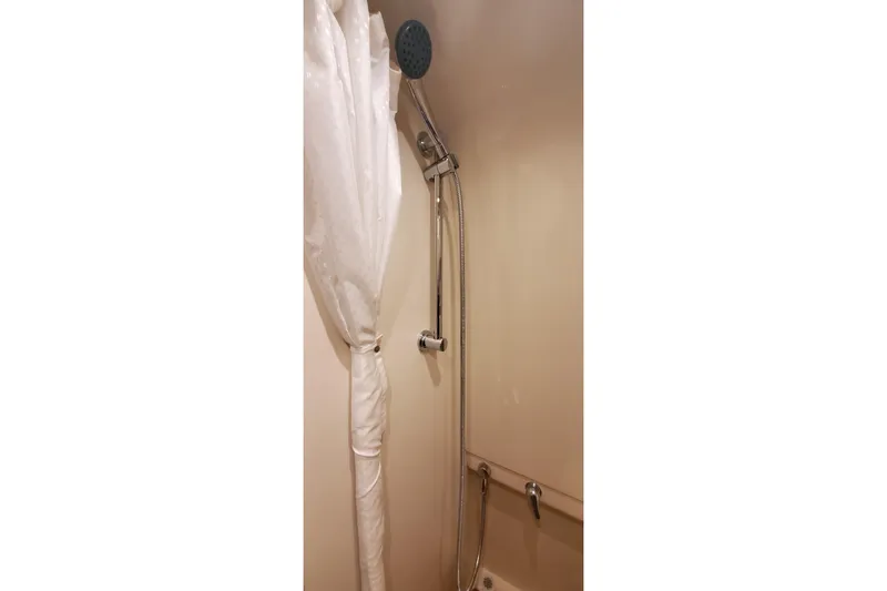 Slide: The Image of Shower area in 2010 Formula 31 Performance Cruiser with curtain and handheld showerhead. - 67