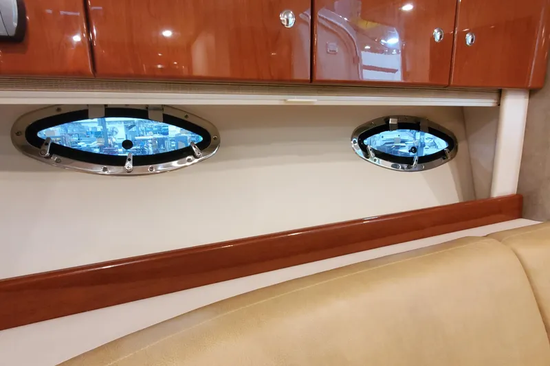 Slide: The Image of Interior of 2010 Formula 31 Performance Cruiser with portholes and wooden cabinetry. - 69