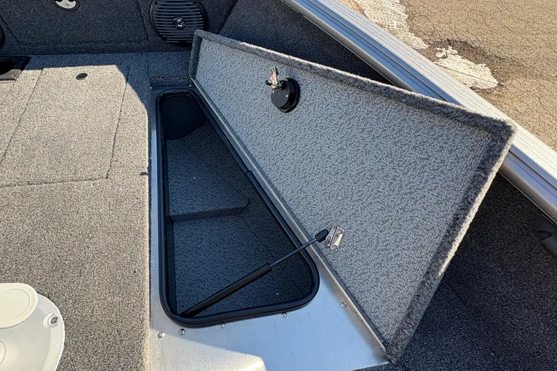 Slide: The Image of Open storage compartment in 2026 Lund 1875 Impact XS Sport boat. - 11