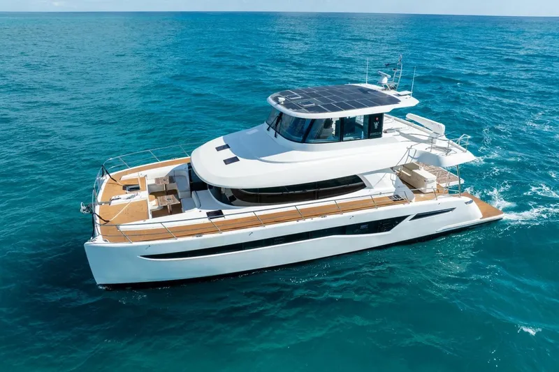 Slide: The Image of 2023 Granocean 57 yacht cruising on open sea, showcasing sleek design and luxury features. - 11