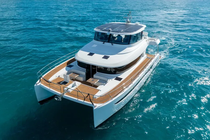 Slide: The Image of 2023 Granocean 57 yacht cruising on clear blue ocean waters. - 12