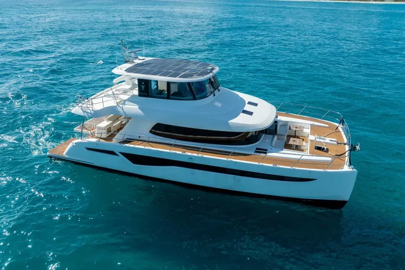 Slide: The Image of Luxury Granocean 57 yacht cruising on clear blue ocean waters, 2023 model. - 13