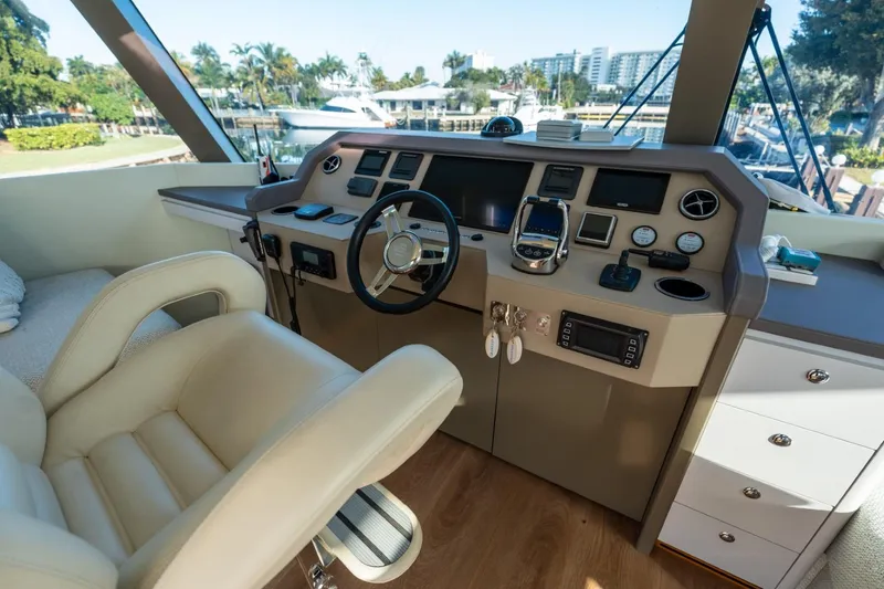 Slide: The Image of Luxurious Granocean 57 yacht helm, 2023 model, featuring modern controls and plush seating. - 14