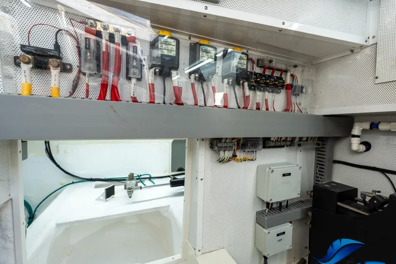 Slide: The Image of Electrical system inside 2023 Granocean 57 yacht, featuring wiring and control panels. - 20
