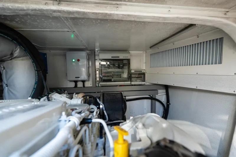Slide: The Image of Engine room of 2023 Granocean 57 yacht, featuring control panels and ventilation system. - 25