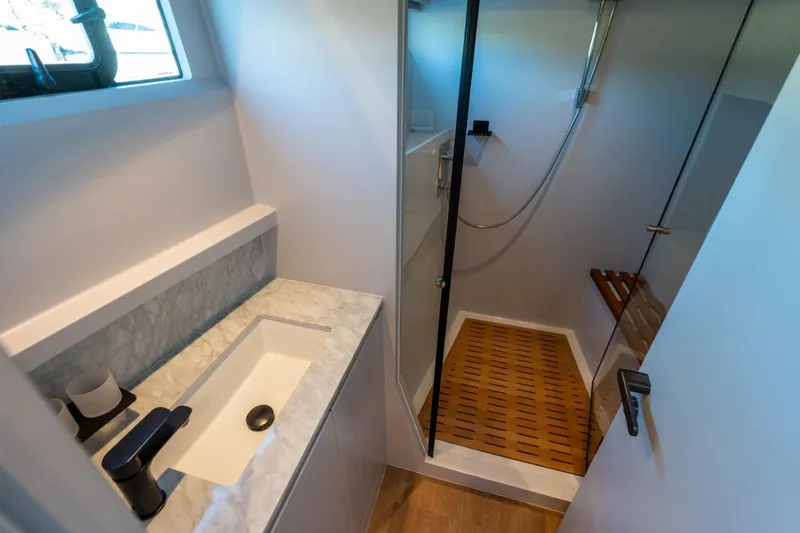 Slide: The Image of Luxurious bathroom in 2023 Granocean 57 yacht with modern shower and marble sink. - 29