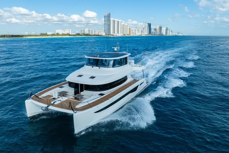 Slide: The Image of Luxury Granocean 57 yacht cruising near city skyline, 2023 model. - 3