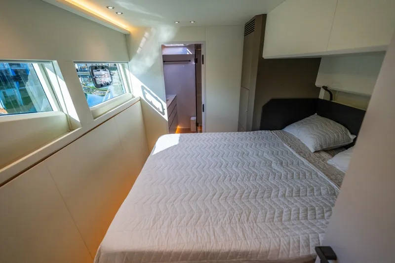 Slide: The Image of Luxurious bedroom interior of 2023 Granocean 57 yacht with modern design and natural light. - 34