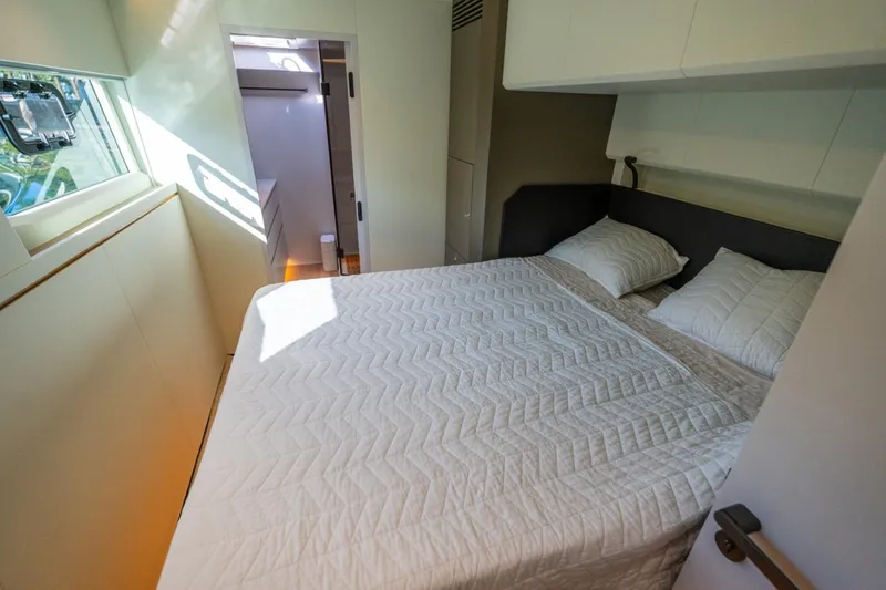 Slide: The Image of Luxurious bedroom interior of 2023 Granocean 57 yacht with cozy bedding. - 35