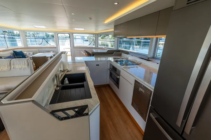 Slide: The Image of Luxurious interior of 2023 Granocean 57 yacht with modern kitchen and panoramic windows. - 38