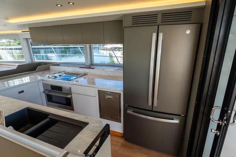 Slide: The Image of Luxurious Granocean 57 yacht kitchen with modern appliances, sleek design, and waterfront view, 2023 model. - 39