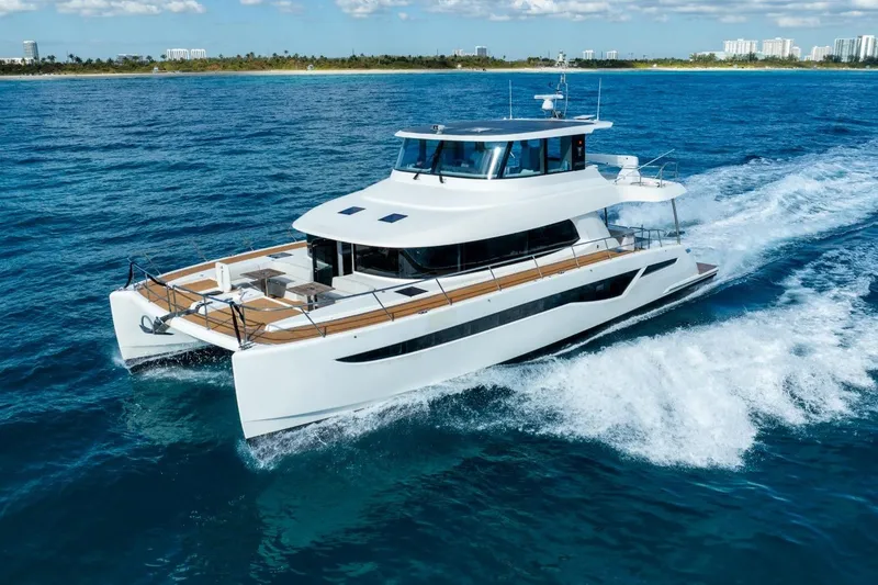 Slide: The Image of 2023 Granocean 57 yacht cruising on blue ocean near coastline. - 4