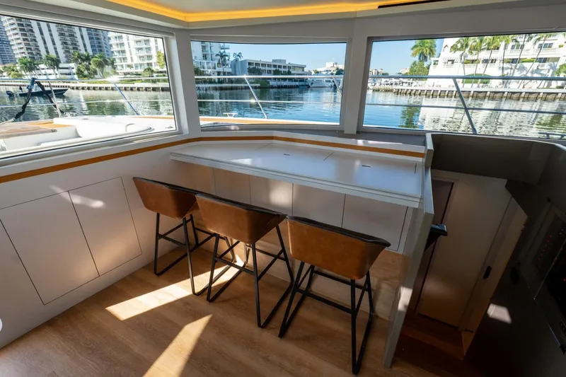 Slide: The Image of Luxurious interior of 2023 Granocean 57 yacht with waterfront view and stylish seating. - 41