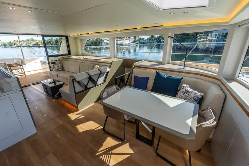 Slide: The Image of Luxurious interior of 2023 Granocean 57 yacht with modern seating and scenic windows. - 46