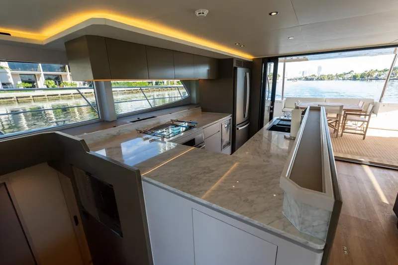 Slide: The Image of Luxurious Granocean 57 yacht interior with modern kitchen and scenic water views, 2023 model. - 47