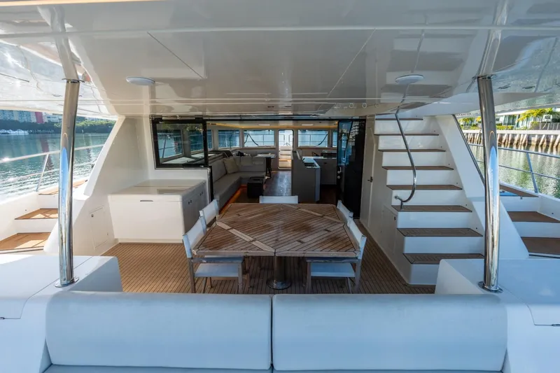 Slide: The Image of Luxurious 2023 Granocean 57 yacht interior with elegant seating and dining area. - 56
