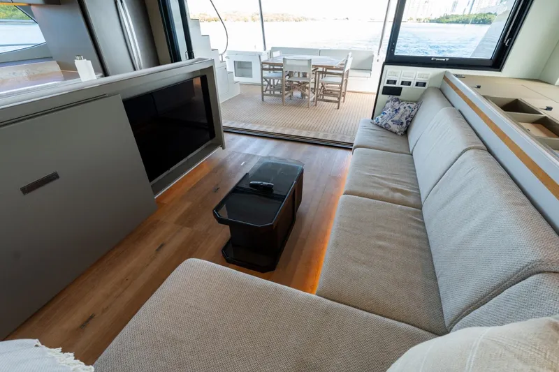 Slide: The Image of Luxurious interior of 2023 Granocean 57 yacht with spacious seating and outdoor dining area. - 59