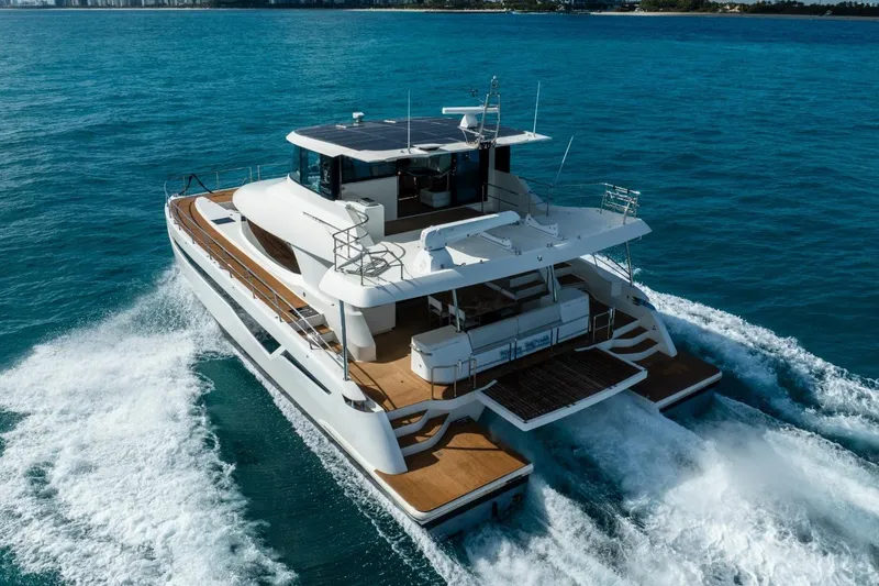 Slide: The Image of Luxurious 2023 Granocean 57 yacht cruising on open blue waters. - 6