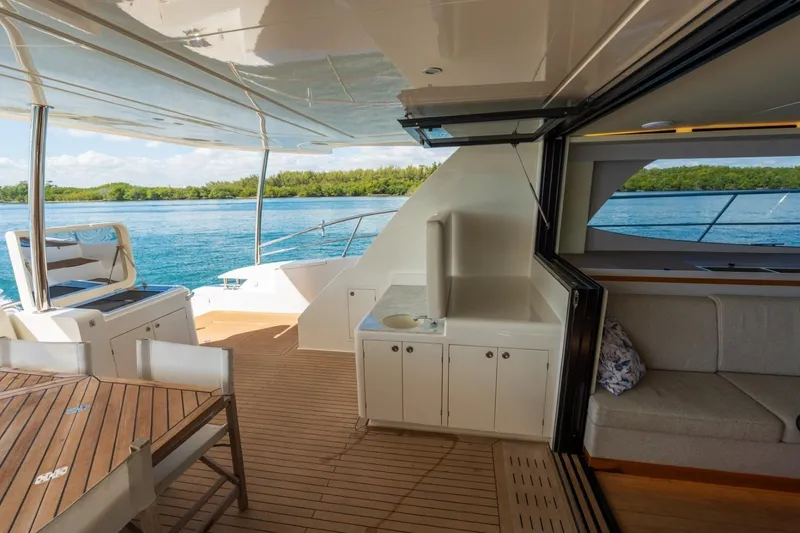 Slide: The Image of Luxurious 2023 Granocean 57 yacht interior with open deck, seating, and ocean view. - 66