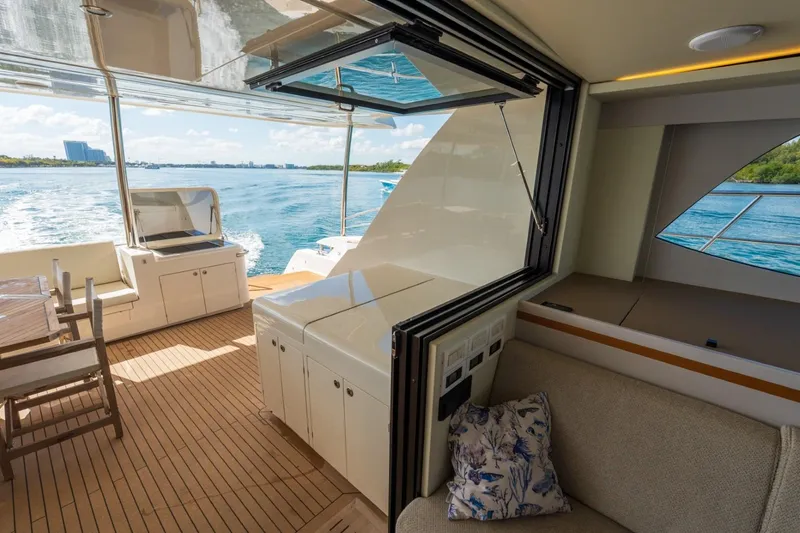 Slide: The Image of Luxurious 2023 Granocean 57 yacht interior with open deck and scenic water view. - 67