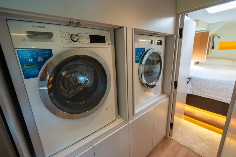 Slide: The Image of Laundry area with Bosch appliances in a 2023 Granocean 57 yacht interior. - 68