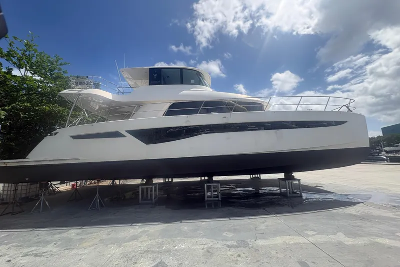 Slide: The Image of 2023 Granocean 57 yacht on dry dock under a sunny sky. - 71