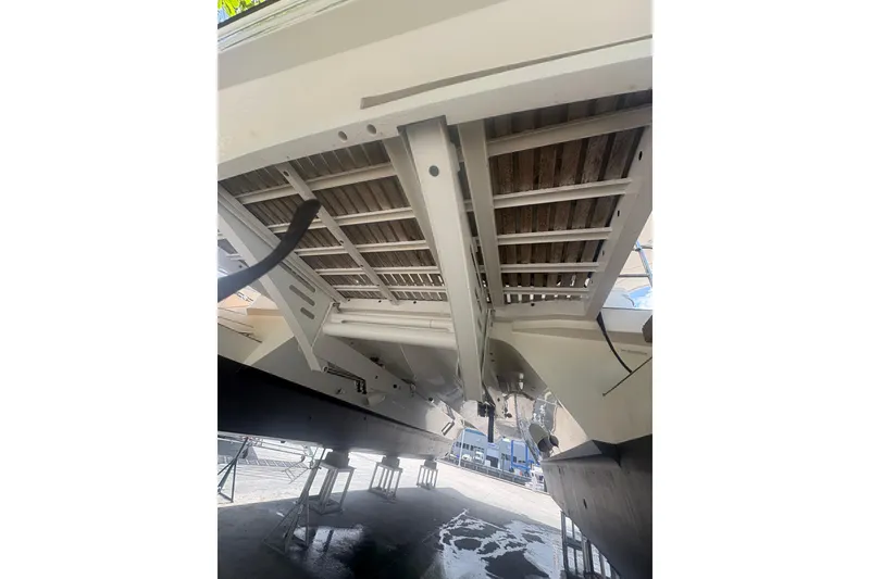 Slide: The Image of Underneath view of 2023 Granocean 57 yacht on dry dock, showcasing hull structure. - 73