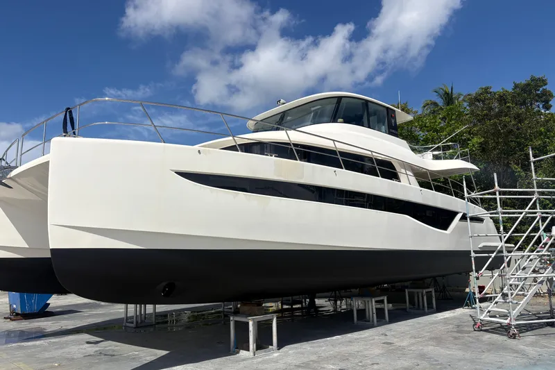 Slide: The Image of 2023 Granocean 57 yacht on dry dock under clear blue sky. - 76