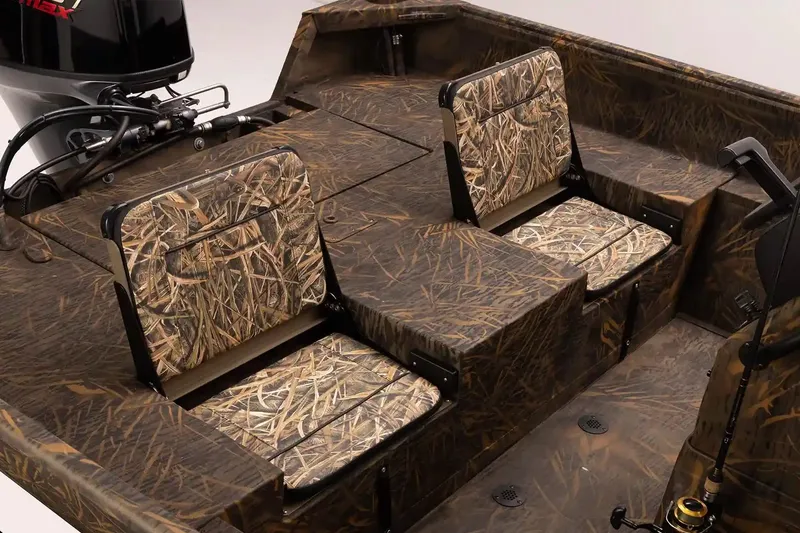 Slide: The Image of 2026 G3 Gator Tough 20 CC boat interior with camouflage seating and motor. - 5