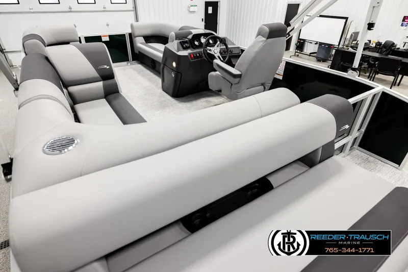 Slide: The Image of 2026 Bennington SLJSF pontoon boat interior with luxurious seating and modern helm. - 11