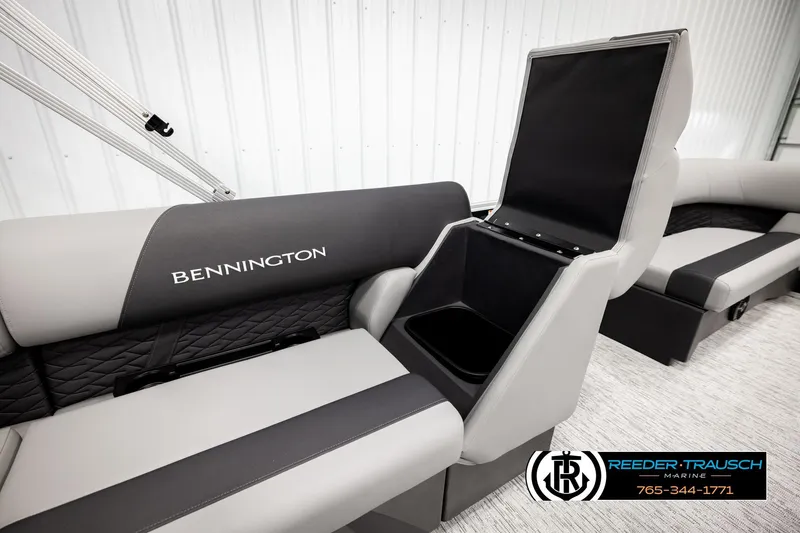 Slide: The Image of 2026 Bennington SLJSF boat interior with storage compartment, featuring sleek gray seating. - 21