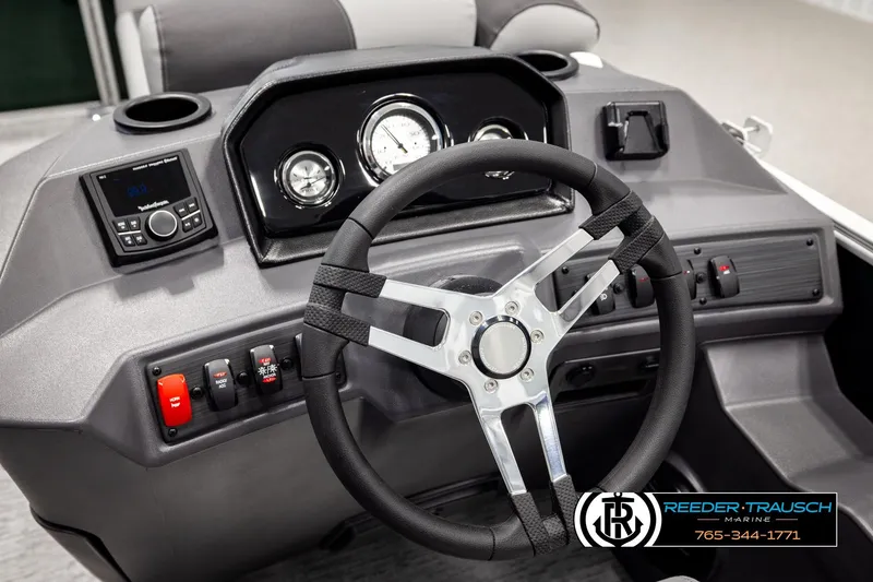 Slide: The Image of 2026 Bennington SLJSF boat dashboard with steering wheel and control panel. - 29