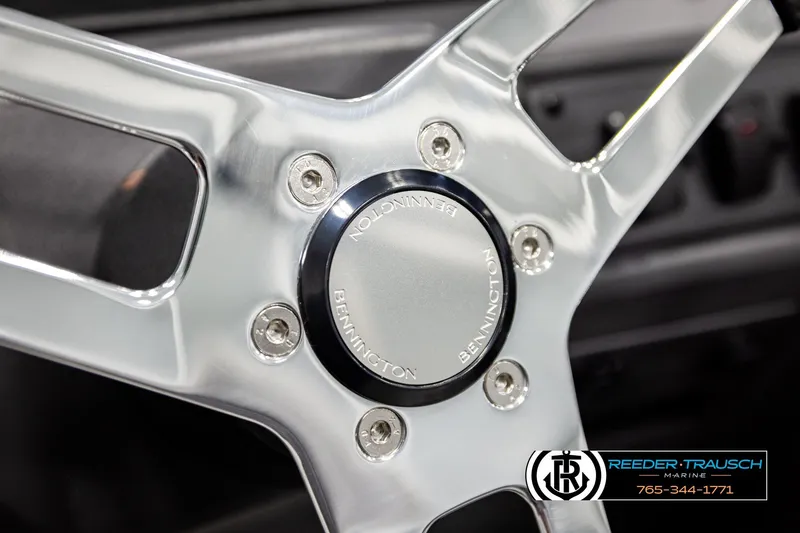 Slide: The Image of Close-up of 2026 Bennington SLJSF steering wheel with logo and metallic finish. - 30