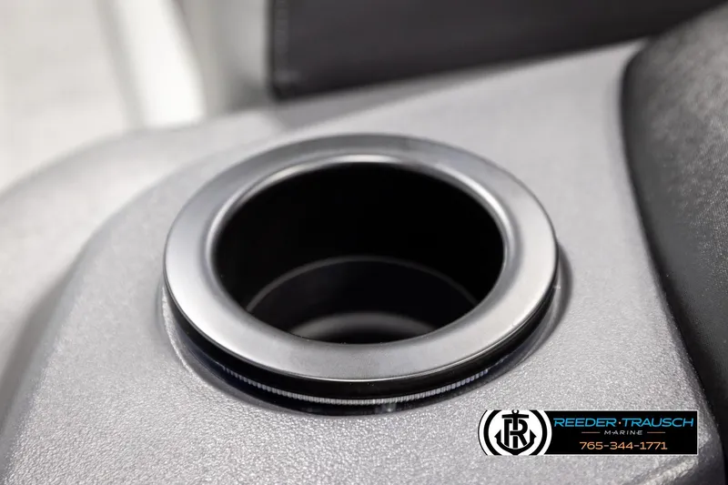 Slide: The Image of Cup holder in 2026 Bennington SLJSF boat interior, Reeder-Trausch Marine logo visible. - 33